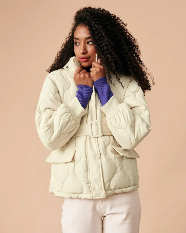 The Beige Mock Neck Belted Quilted Puffer Jacket sold by rihoas