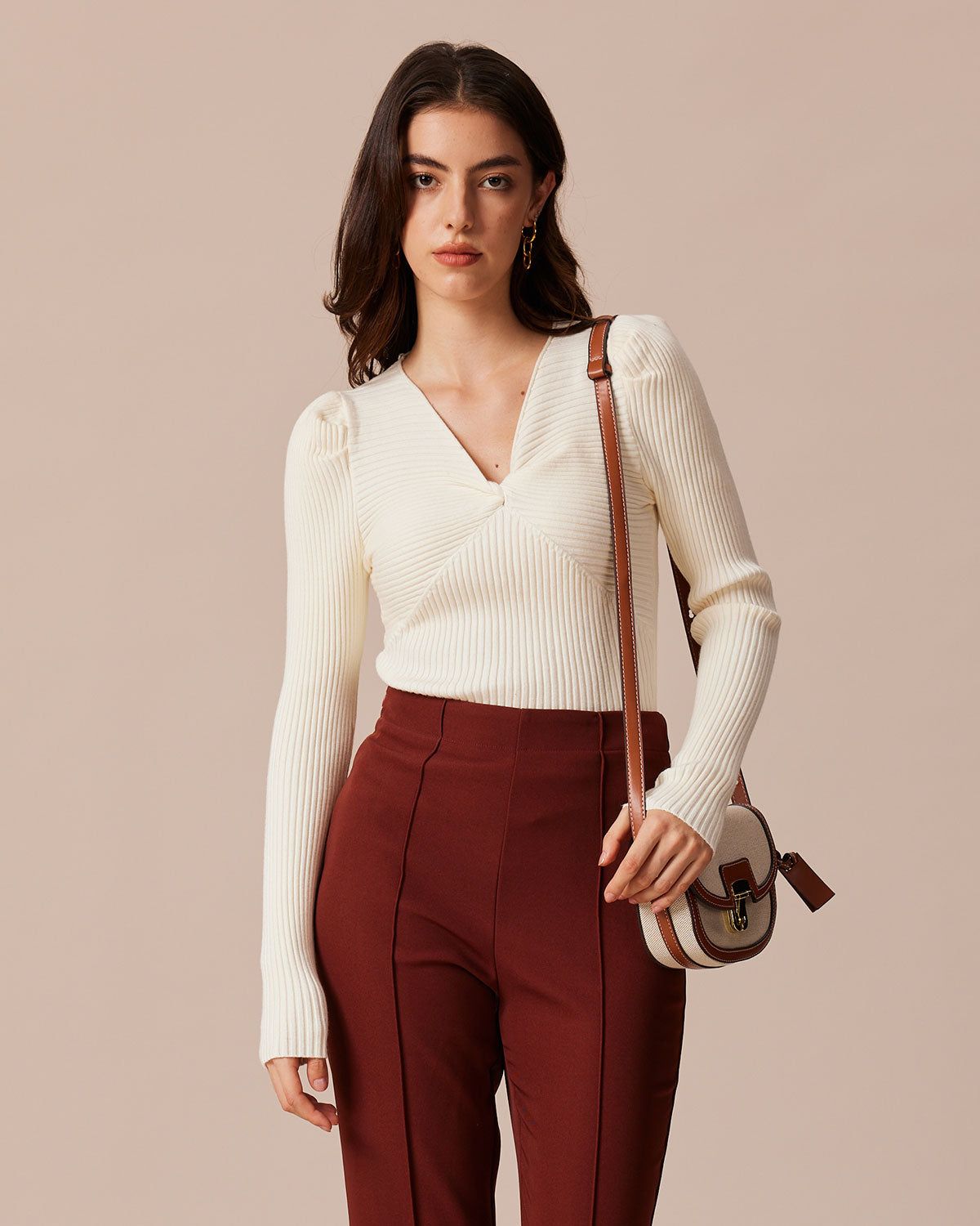 The Beige V Neck Twist Front Ribbed Knit Top sold by rihoas