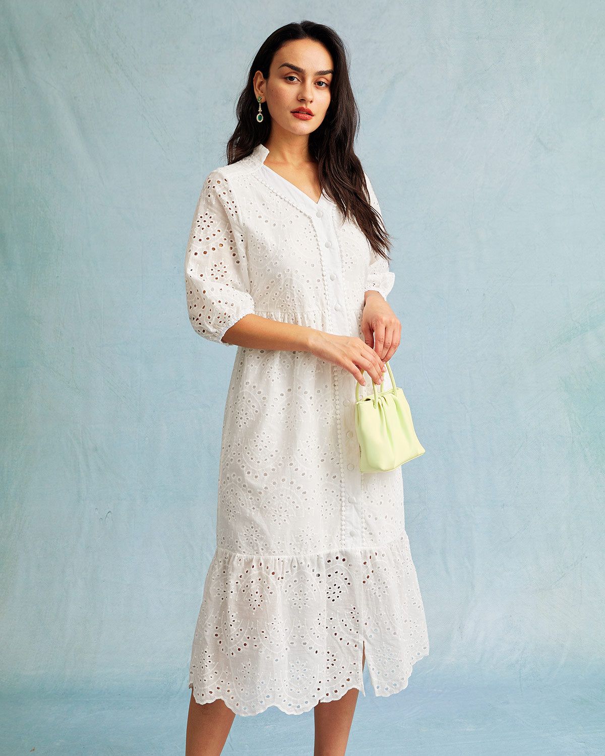 The White V Neck Embroidered Cutout Midi Dress sold by rihoas