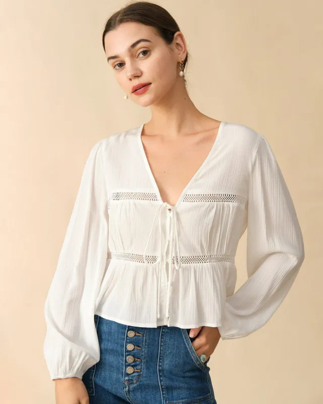 The Spliced Tie Front Cutout Blouse sold by rihoas