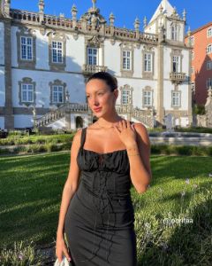 The Black Cutout Tie Front Ruched Bodycon Midi Dress sold by rihoas