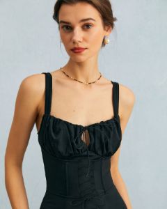 The Black Cutout Tie Front Ruched Bodycon Midi Dress sold by rihoas