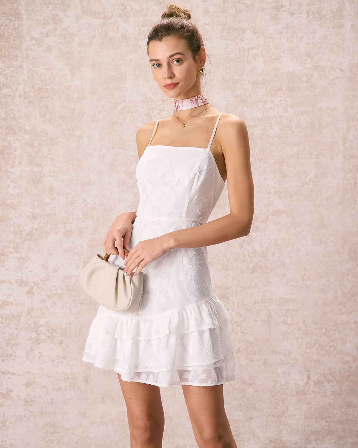 The White Jacquard Ruffle Strap Mini Dress sold by rihoas