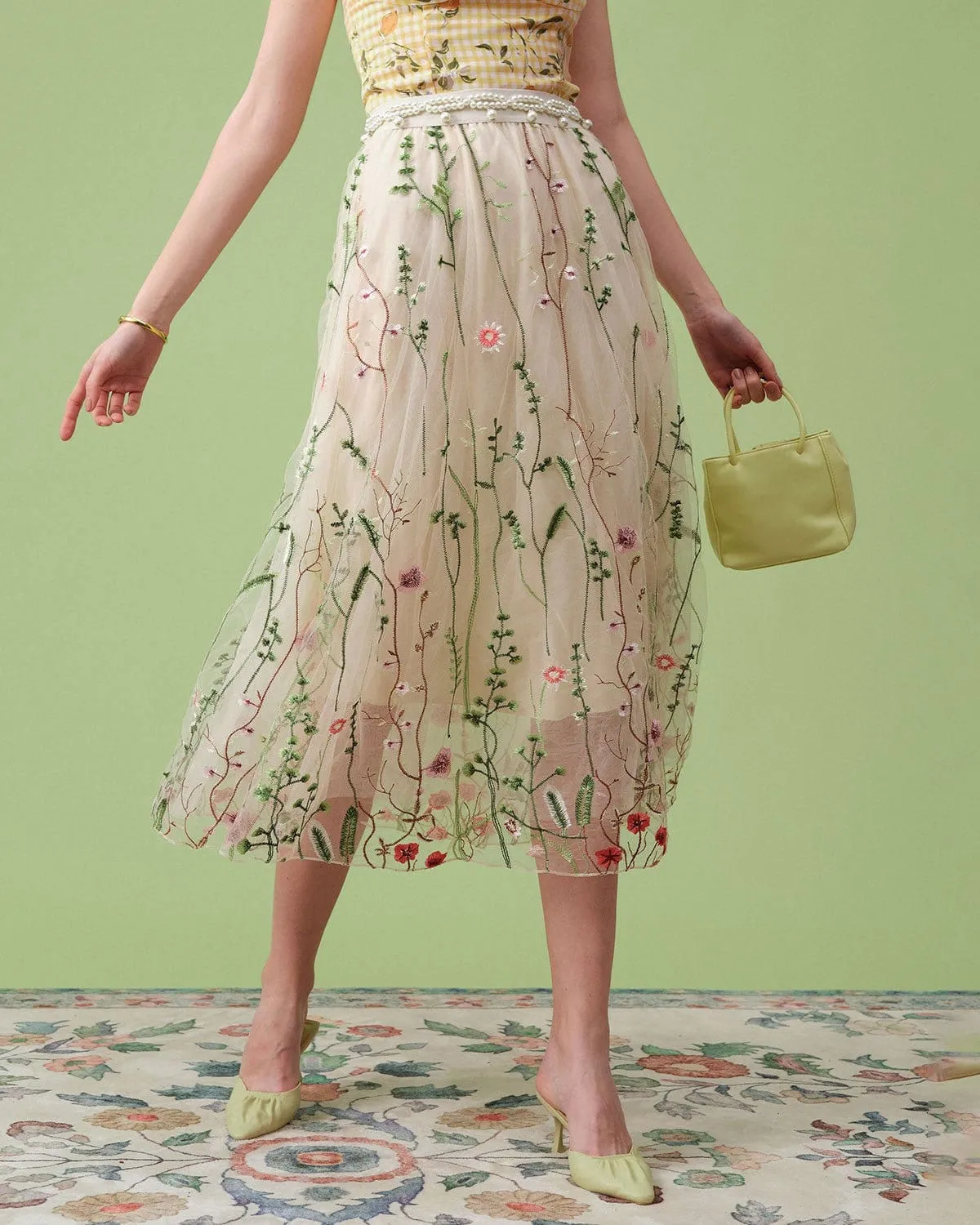 The High Waisted Floral Embroidery A-line Midi Skirt sold by rihoas