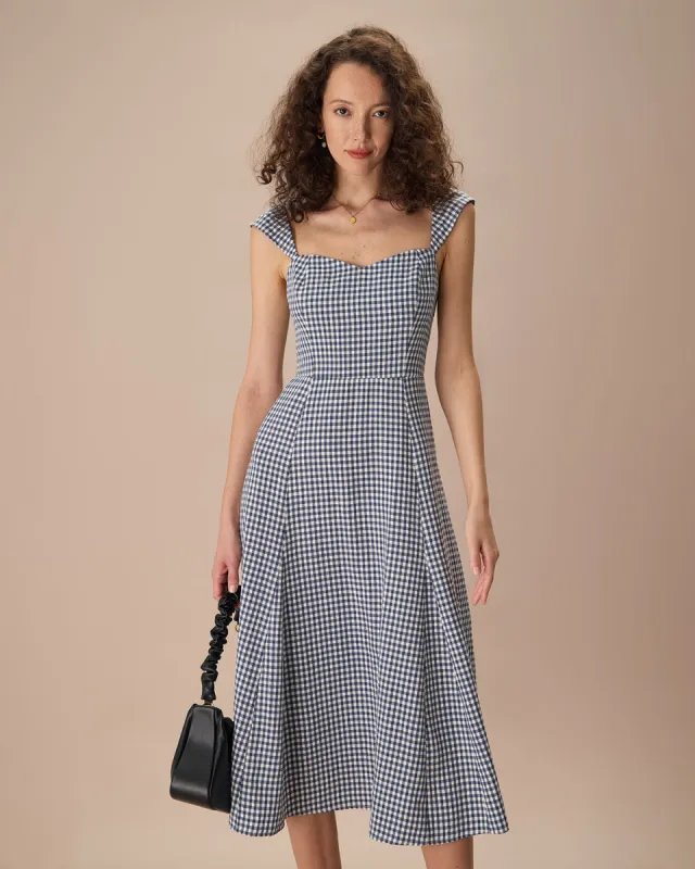 The Navy Plaid Shirred Back Midi Dress sold by rihoas