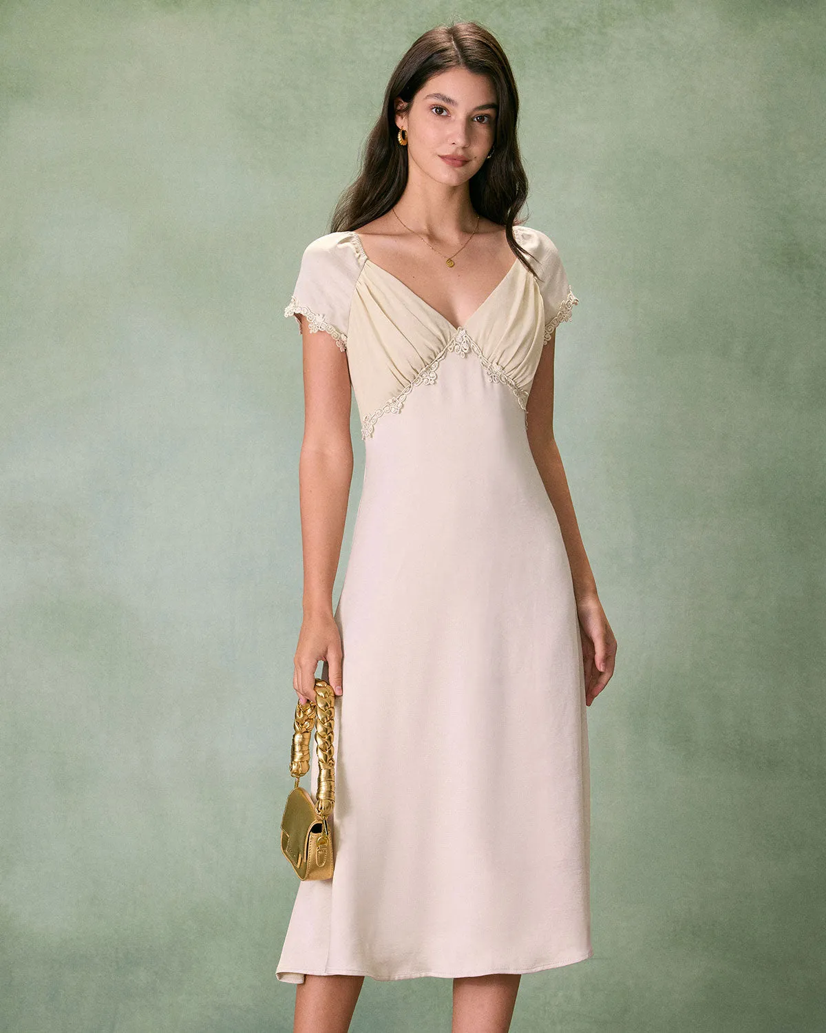 The Apricot V Neck Ruched Satin Midi Dress sold by rihoas