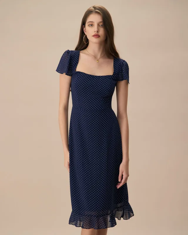 The Navy Polka Dot Cutout Midi Dress sold by rihoas