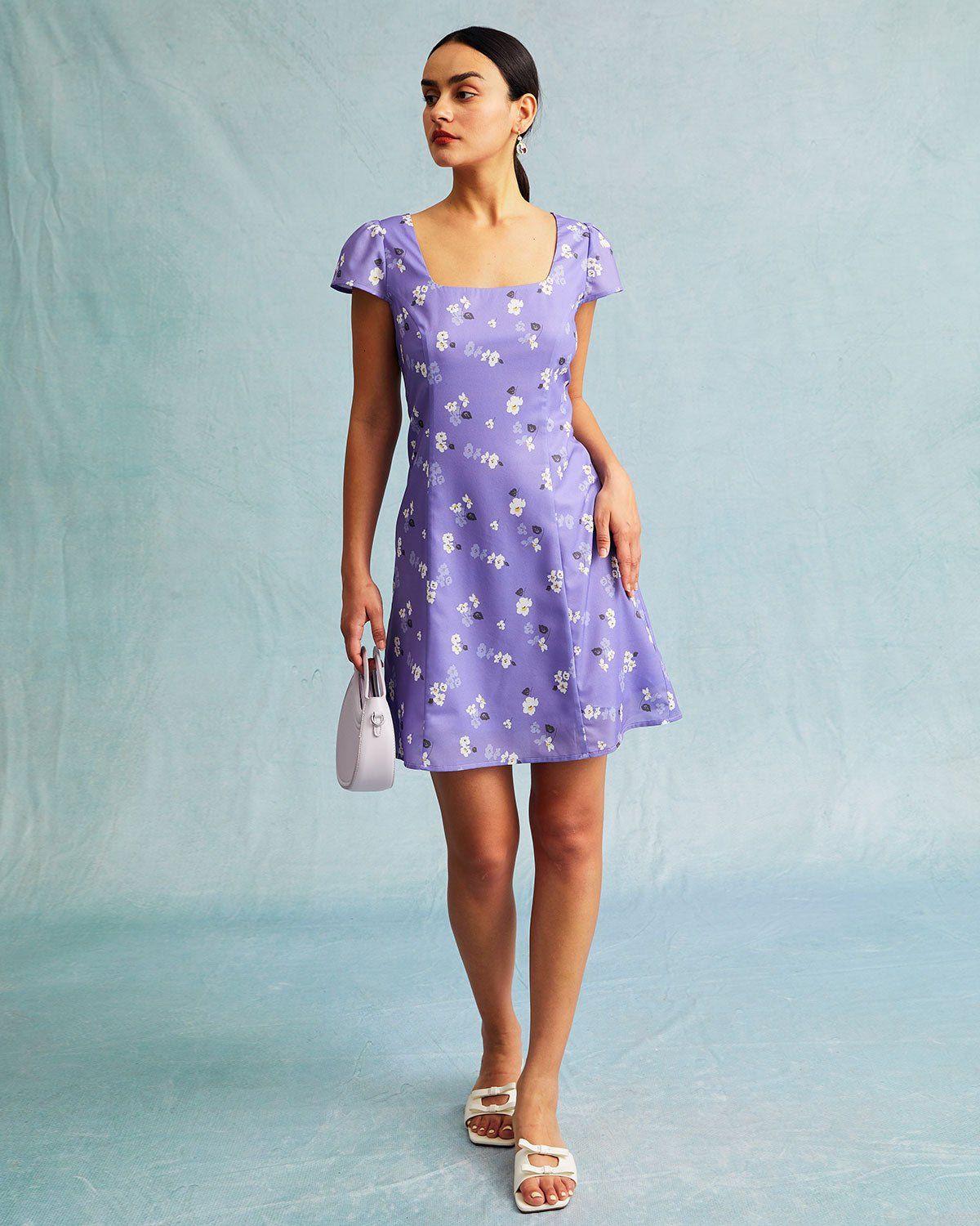 The Purple Floral Tie Back Cap Sleeve Mini Dress sold by rihoas product image thumbnail 2