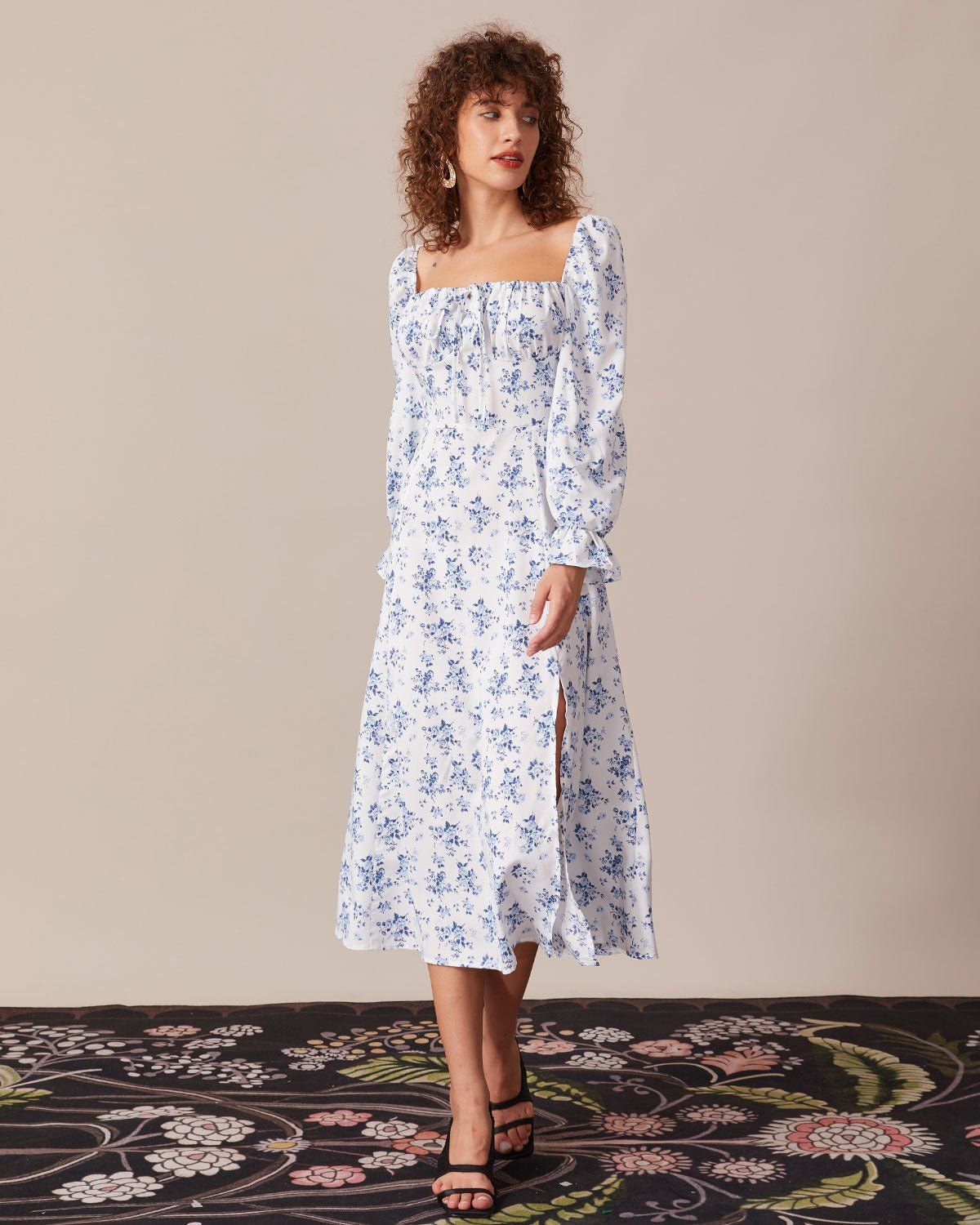 The Blue Floral Ruched Puff Sleeve Midi Dress sold by rihoas