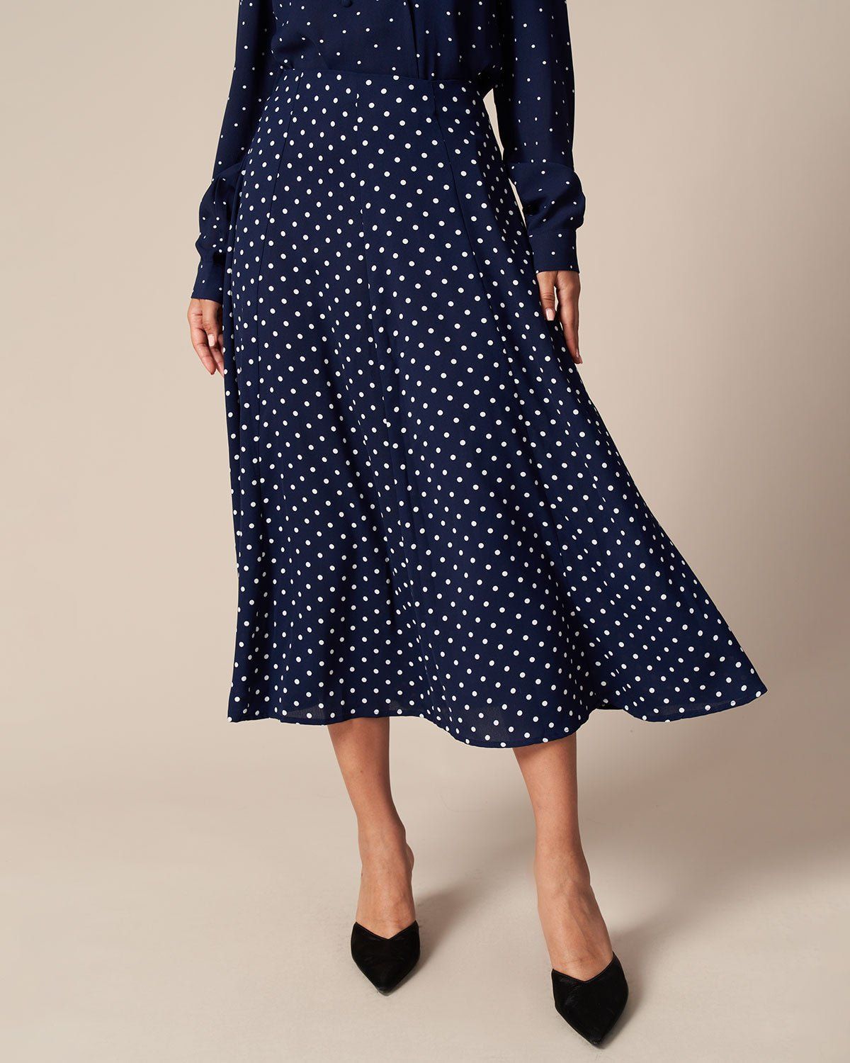 The Navy High Waisted Polka Dot Midi Skirt sold by rihoas