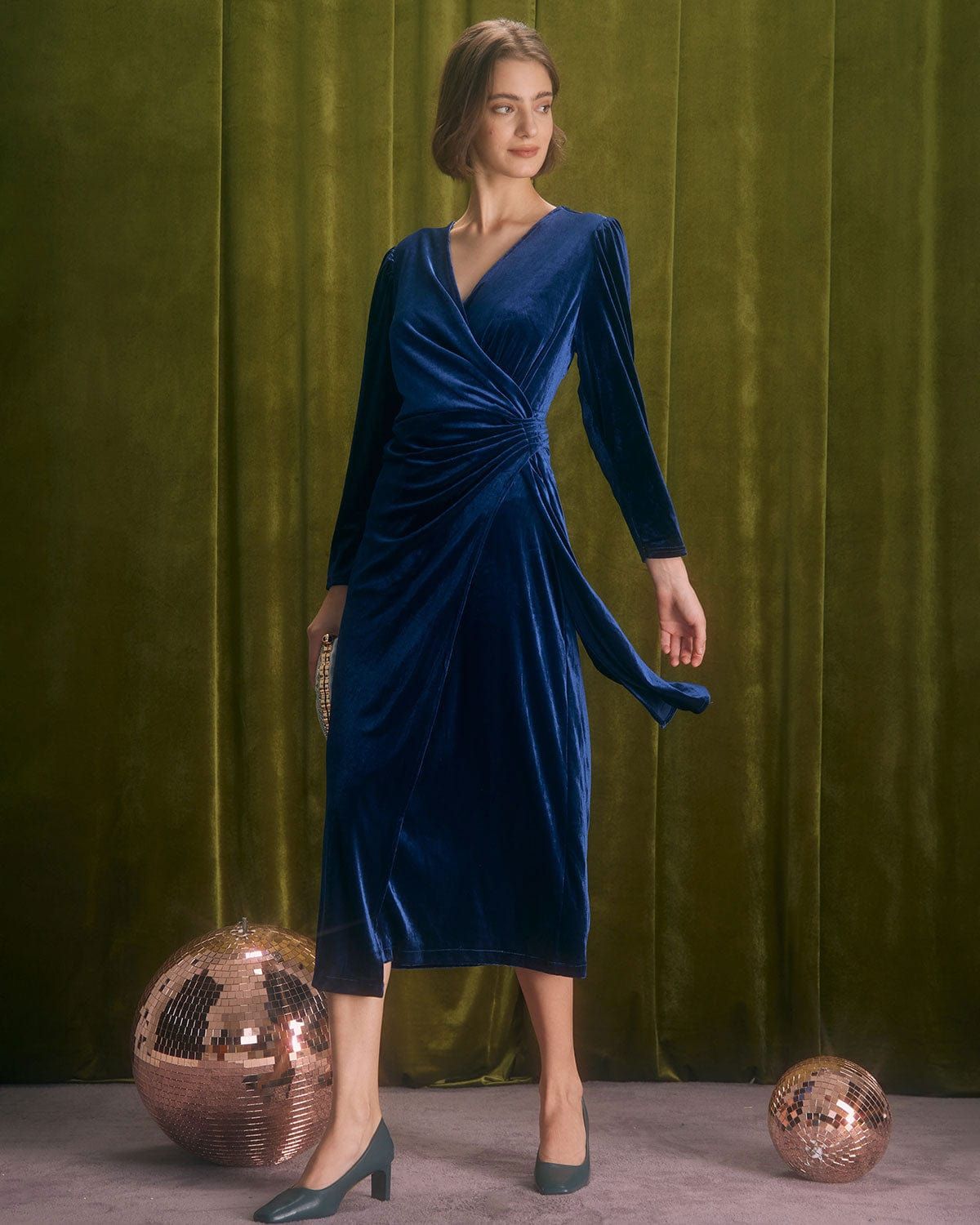 The Navy V Neck Wrap Velvet Midi Dress sold by rihoas