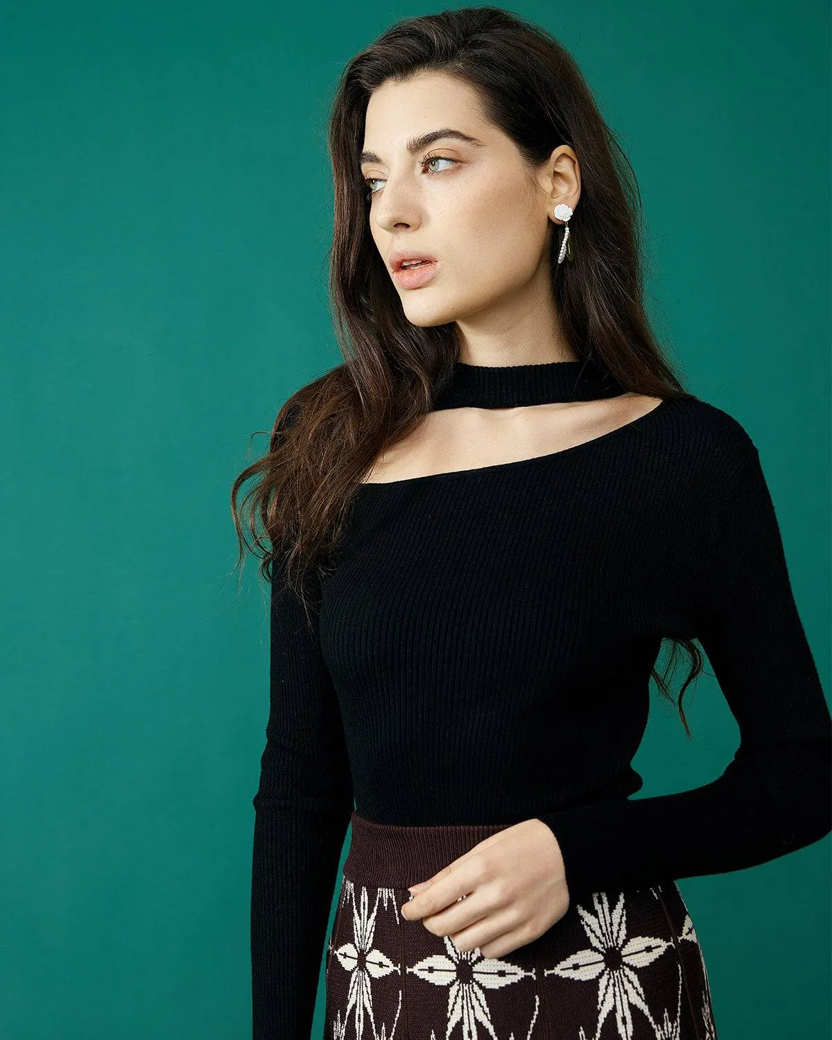 The Slim-Fitting Cutout Knit Top sold by rihoas