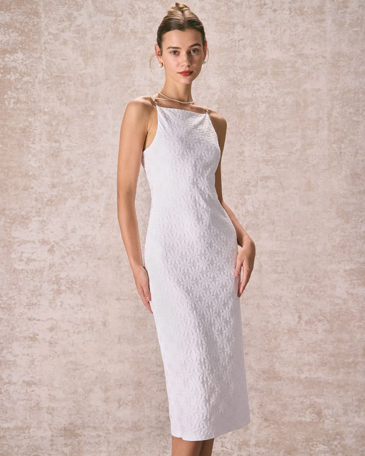 The White Floral Textured Pearl Slip Midi Dress sold by rihoas