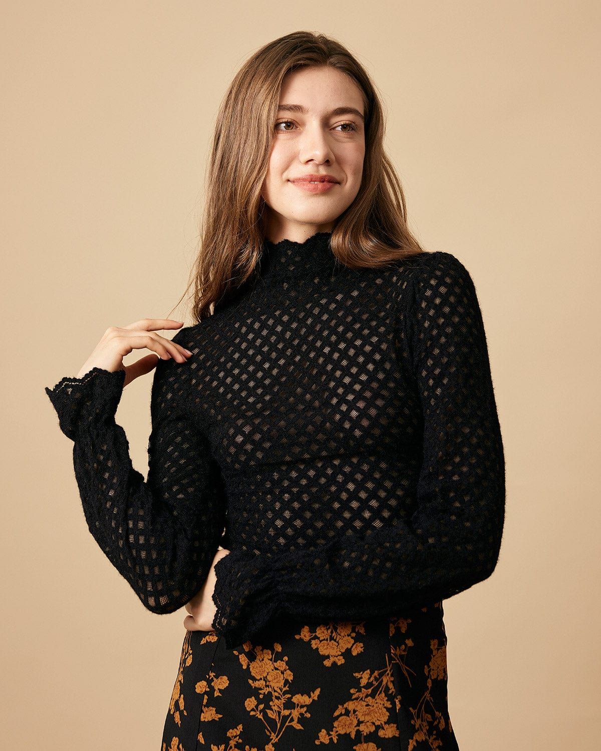 The Black Solid Mock Neck See-through Knit Top sold by rihoas