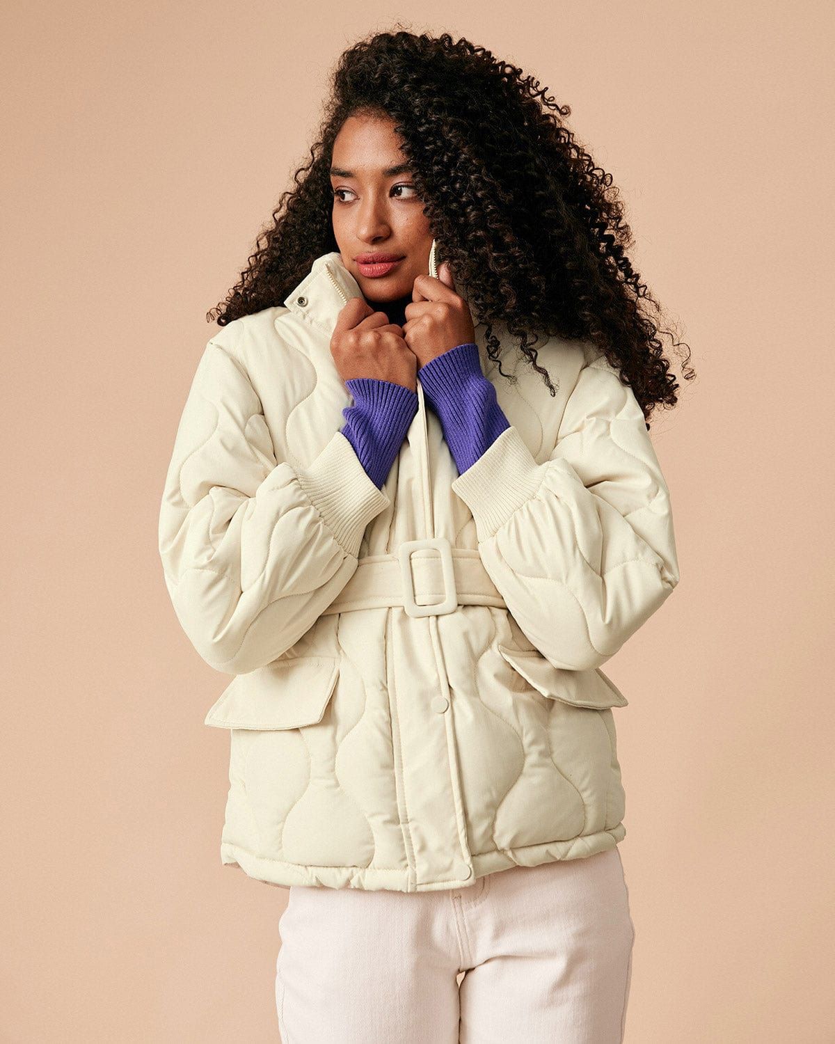 The Beige Mock Neck Belted Quilted Puffer Jacket sold by rihoas