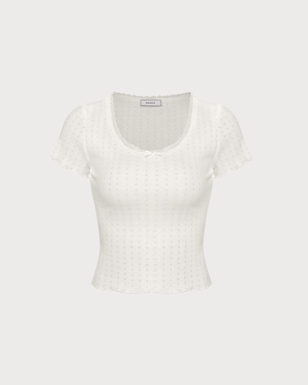 The White Round Neck Lace Pointelle Knit Top sold by rihoas