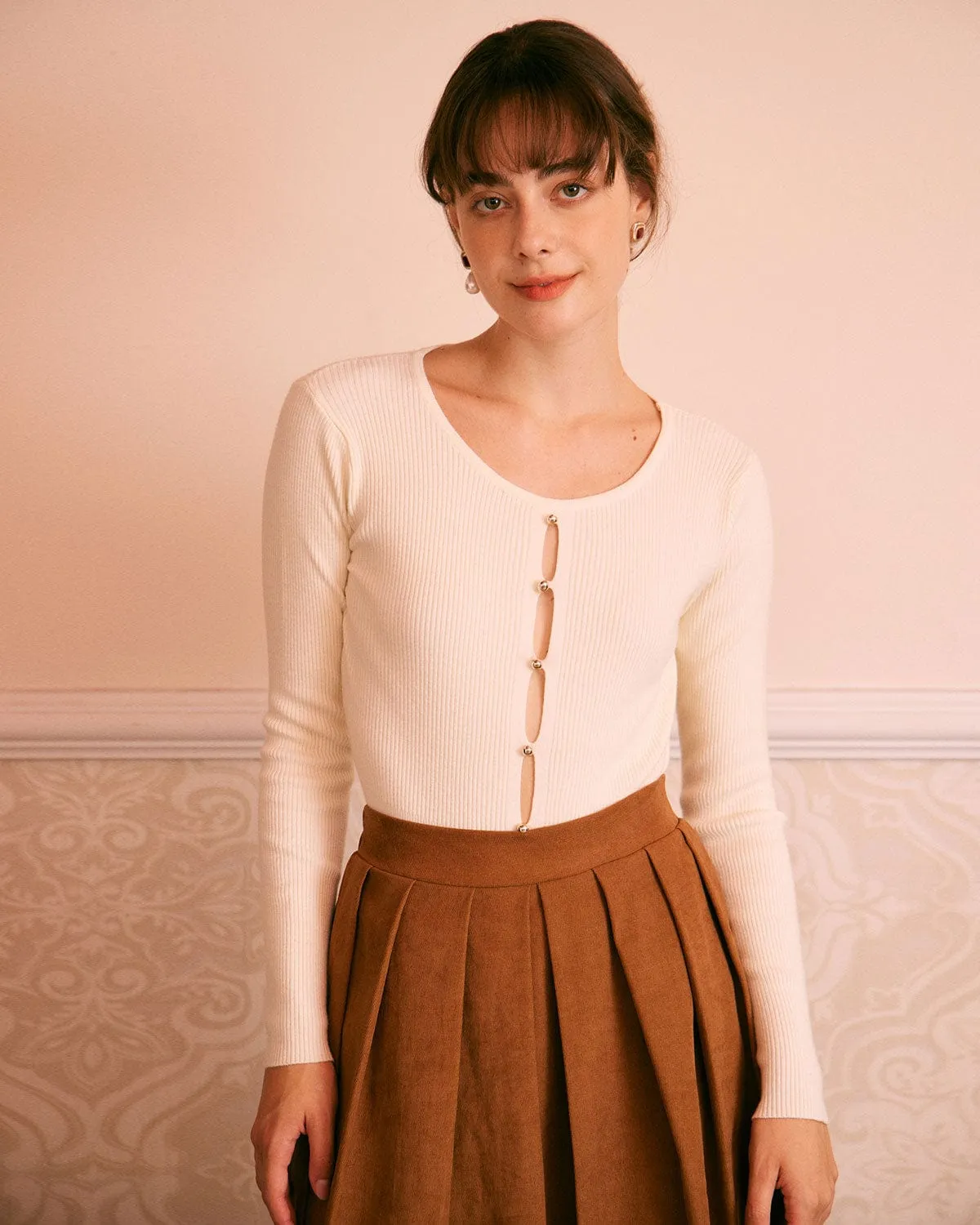 The Apricot Cut Out Long Sleeve Knit Top sold by rihoas
