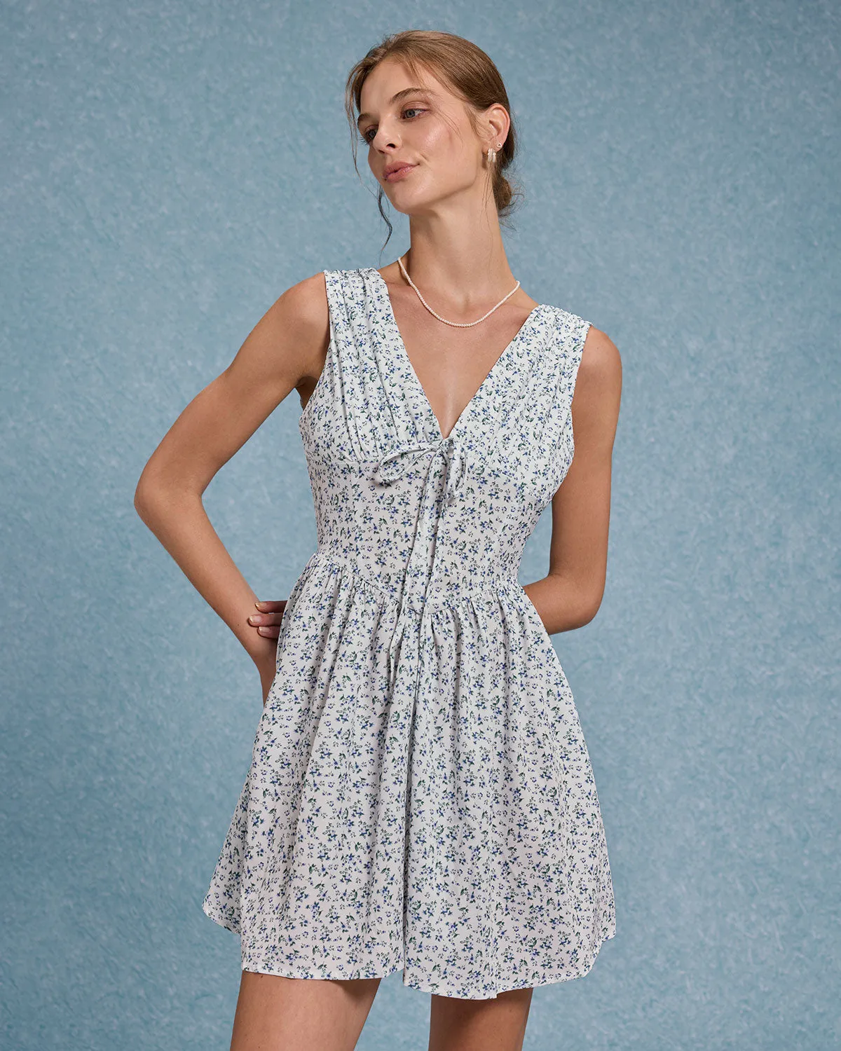 Blue Floral V Neck Pleated Mini Dress sold by rihoas