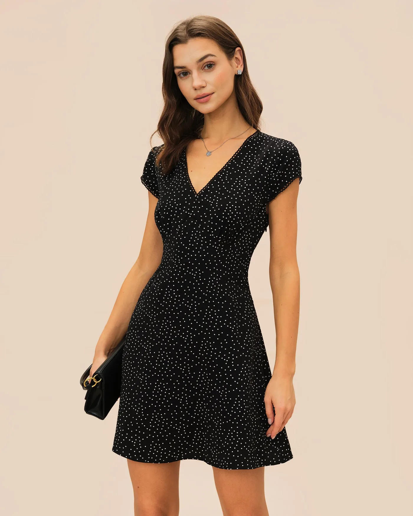 Black Polka Dot V Neck Mini Dress sold by rihoas