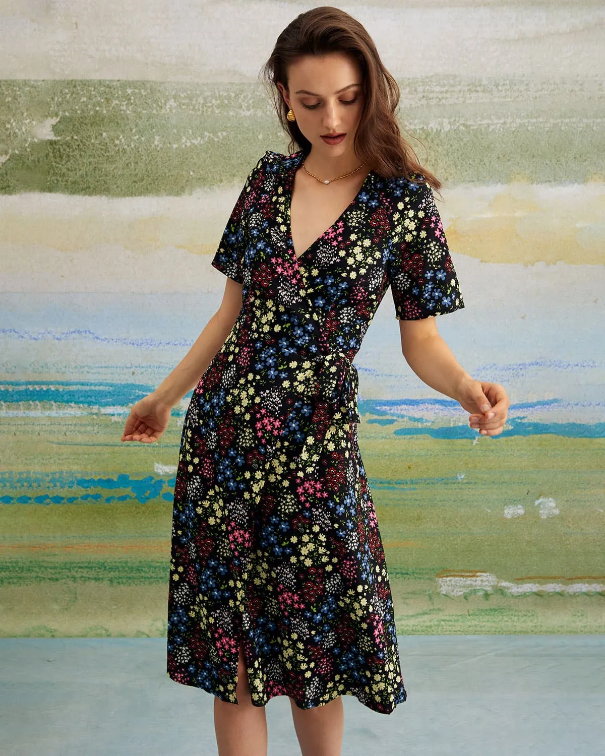 The Black V Neck Floral Tie Back Midi Dress sold by rihoas