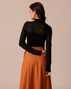 The Black High Neck Sheer Pointelle Knit Top sold by rihoas