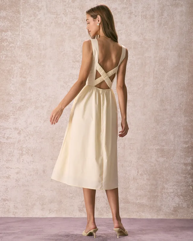 The Light Yellow Pleated Cross Back Midi Dress sold by rihoas