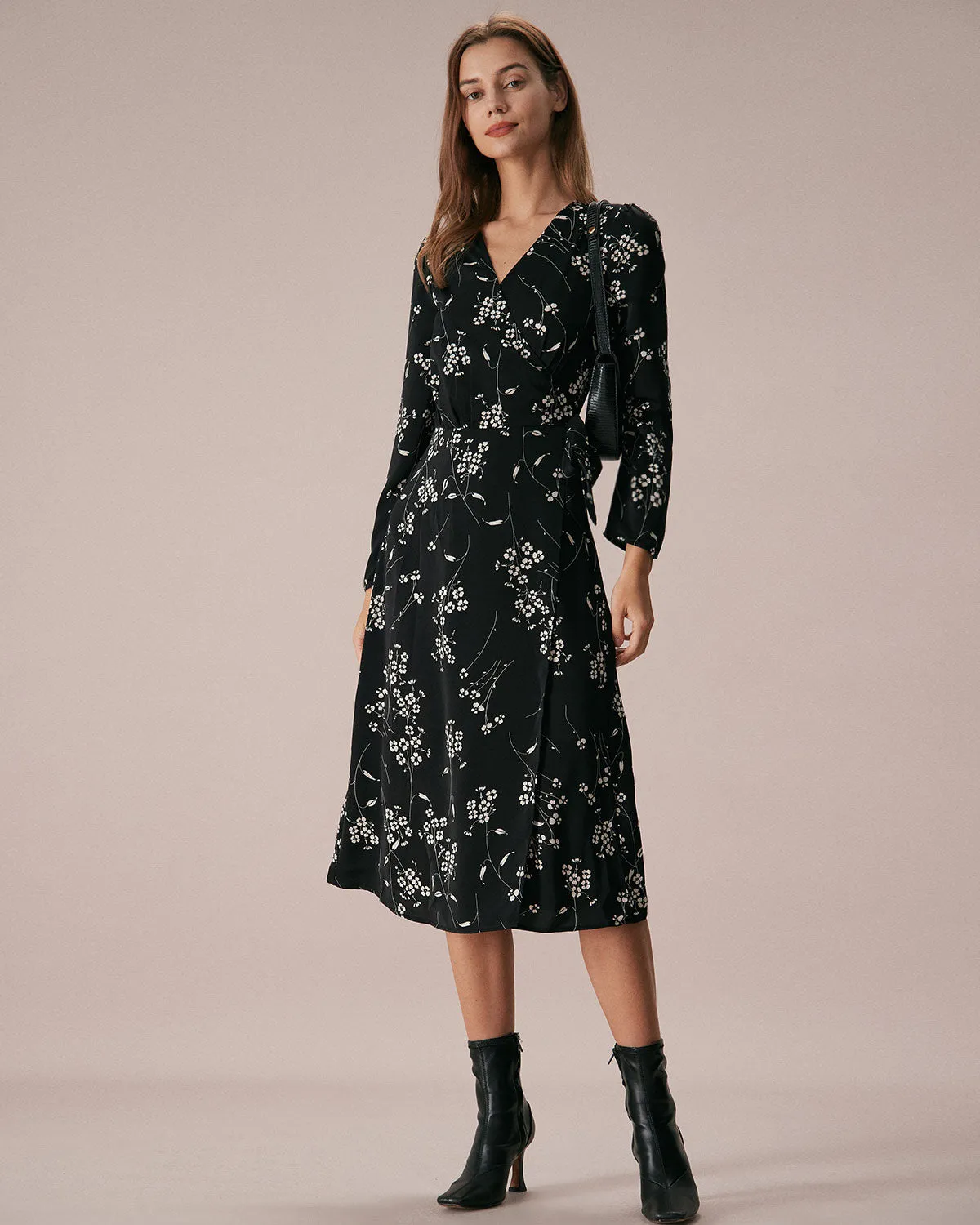 The Black V Neck Wrap Floral Midi Dress sold by rihoas