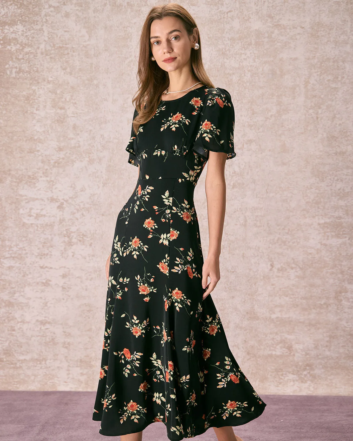 The Black Round Neck Floral Cutout Maxi Dress sold by rihoas