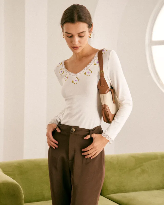 The Beige V Neck Floral Embroidery Knit Top sold by rihoas