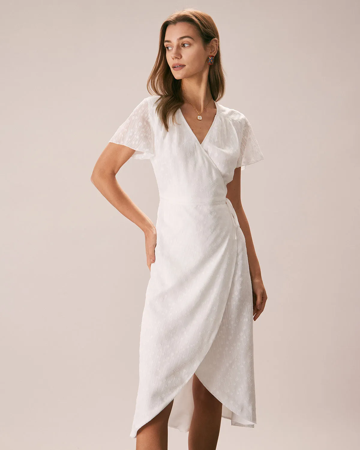 The White V Neck Dobby Mesh Midi Dress sold by rihoas