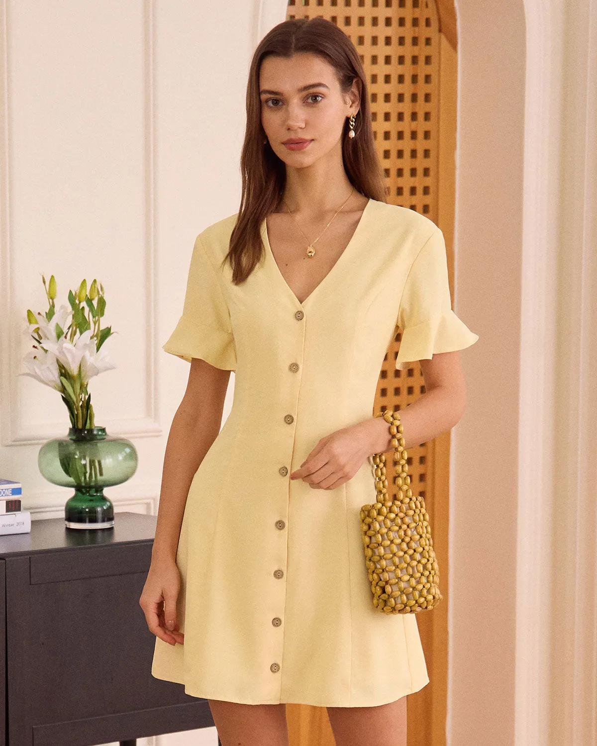 The Yellow V Neck Ruffle Button-up Mini Dress sold by rihoas