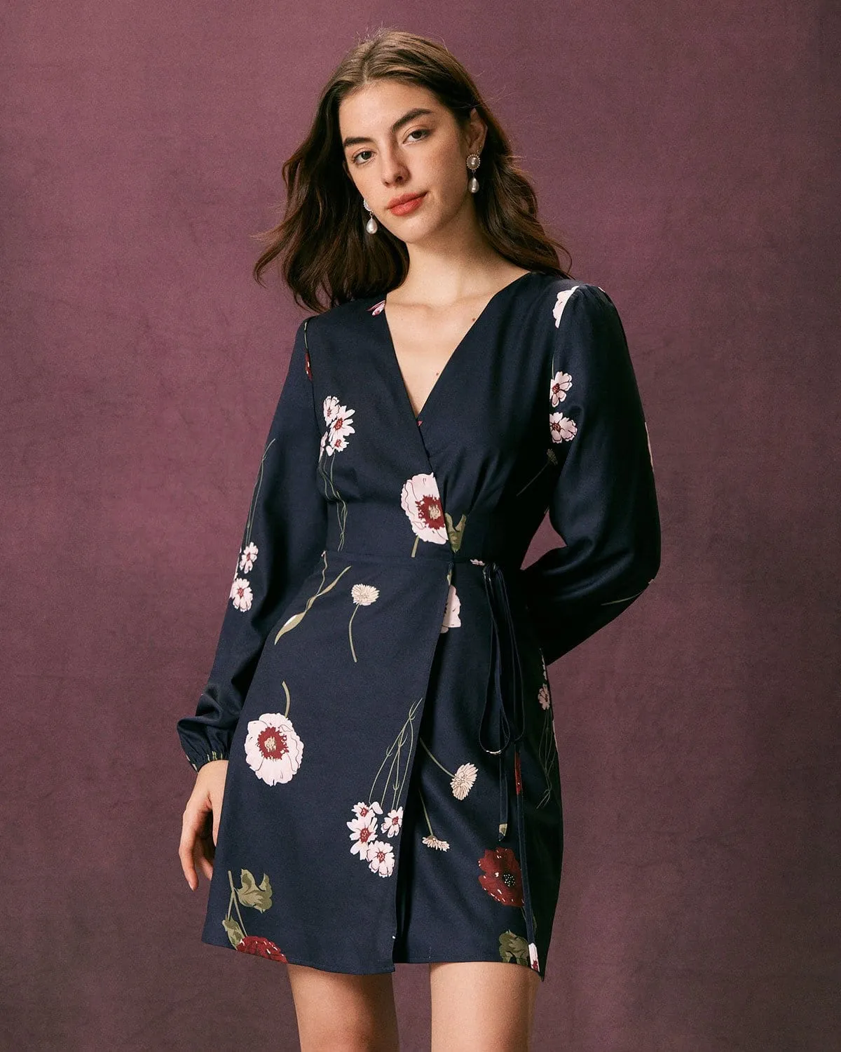 The Navy V Neck Floral Tie Wrap Mini Dress sold by rihoas