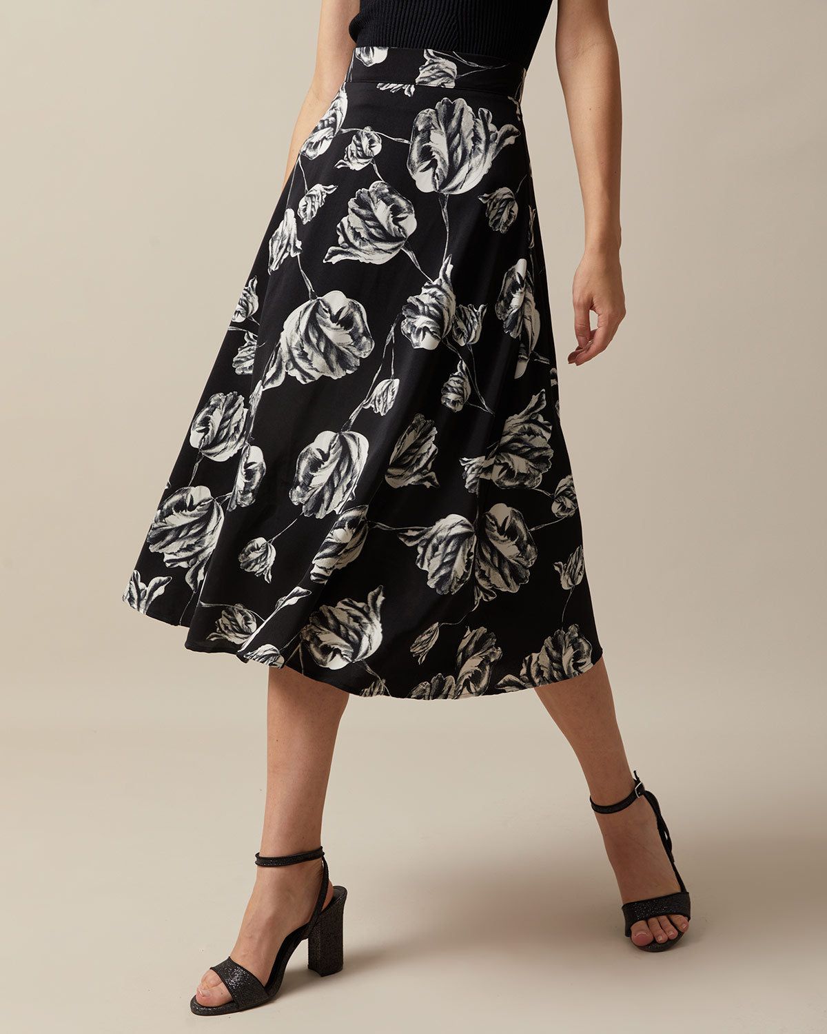 The Black High Waisted Floral Midi Skirt sold by rihoas