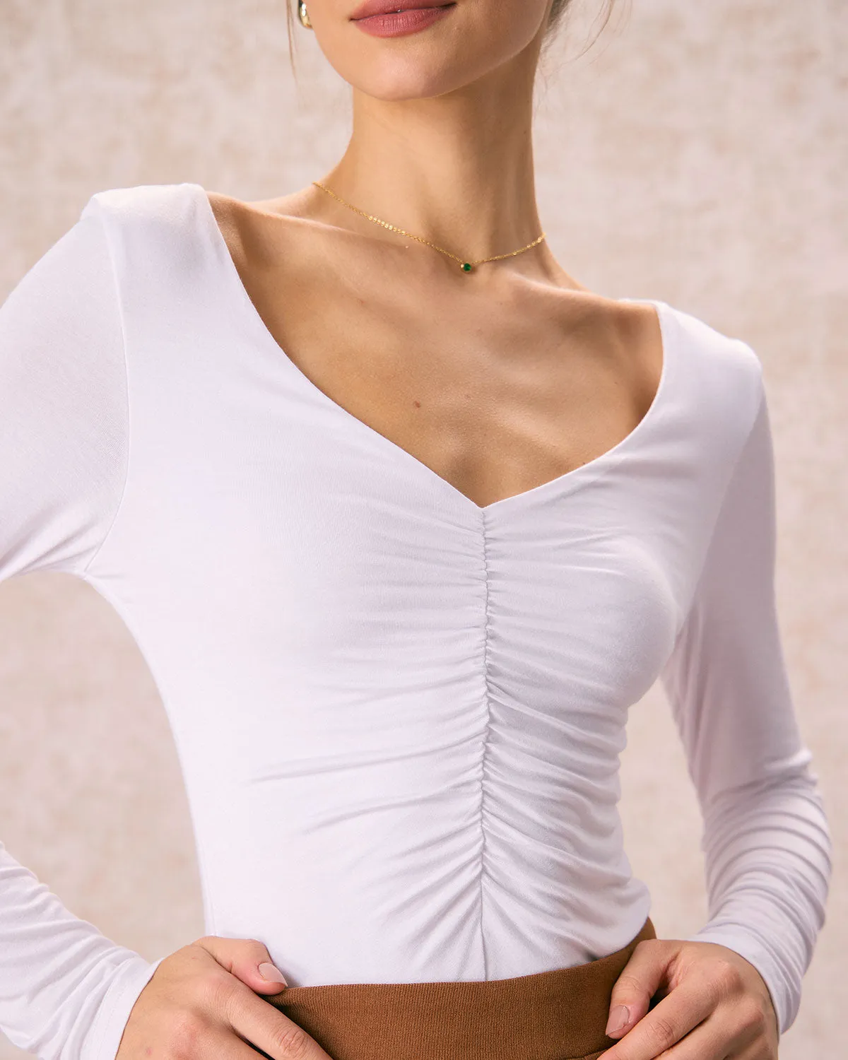 The White V Neck Ruched Long Sleeve Tee sold by rihoas product image thumbnail 2