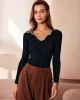 The Black Lapel Seam Colorblock Knit Top sold by rihoas