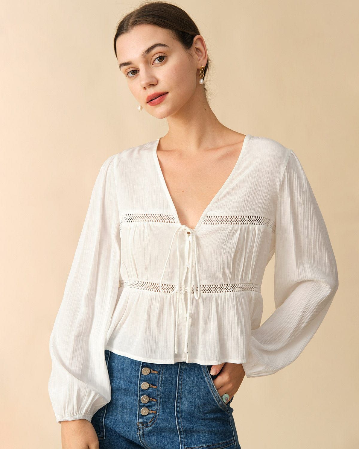 The Spliced Tie Front Cutout Blouse sold by rihoas