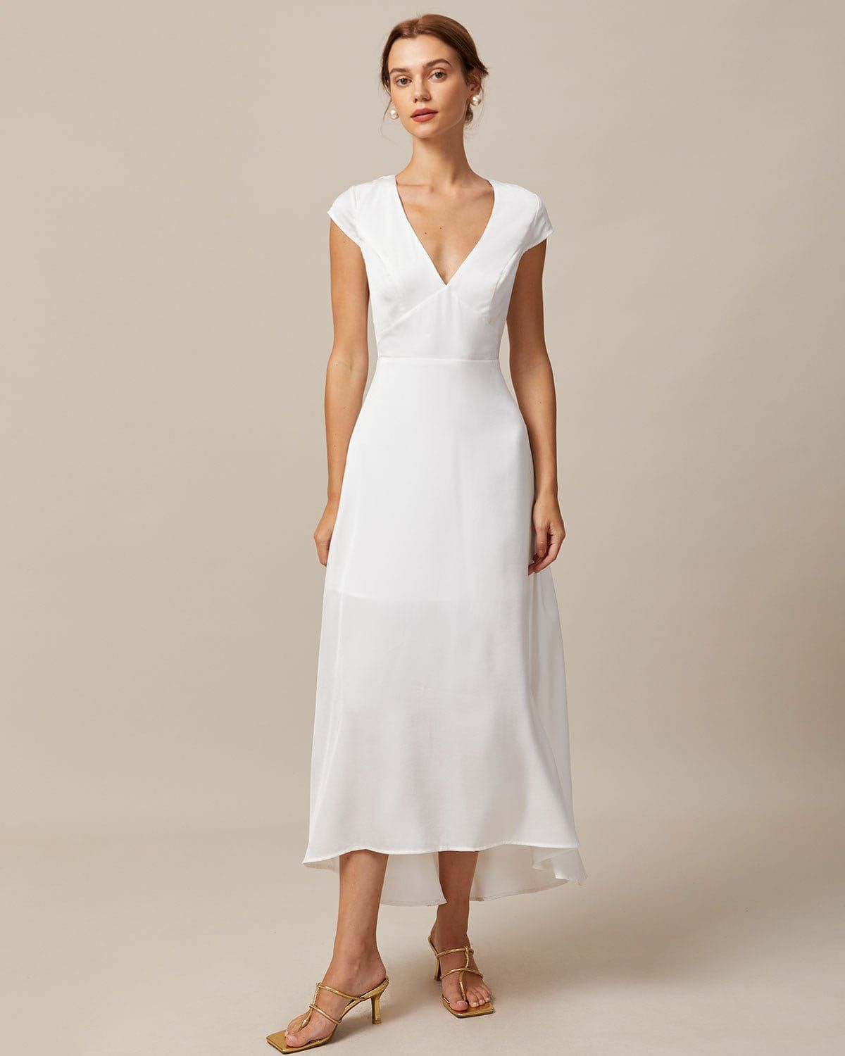The White V Neck Cut Out Satin Maxi Dress sold by rihoas