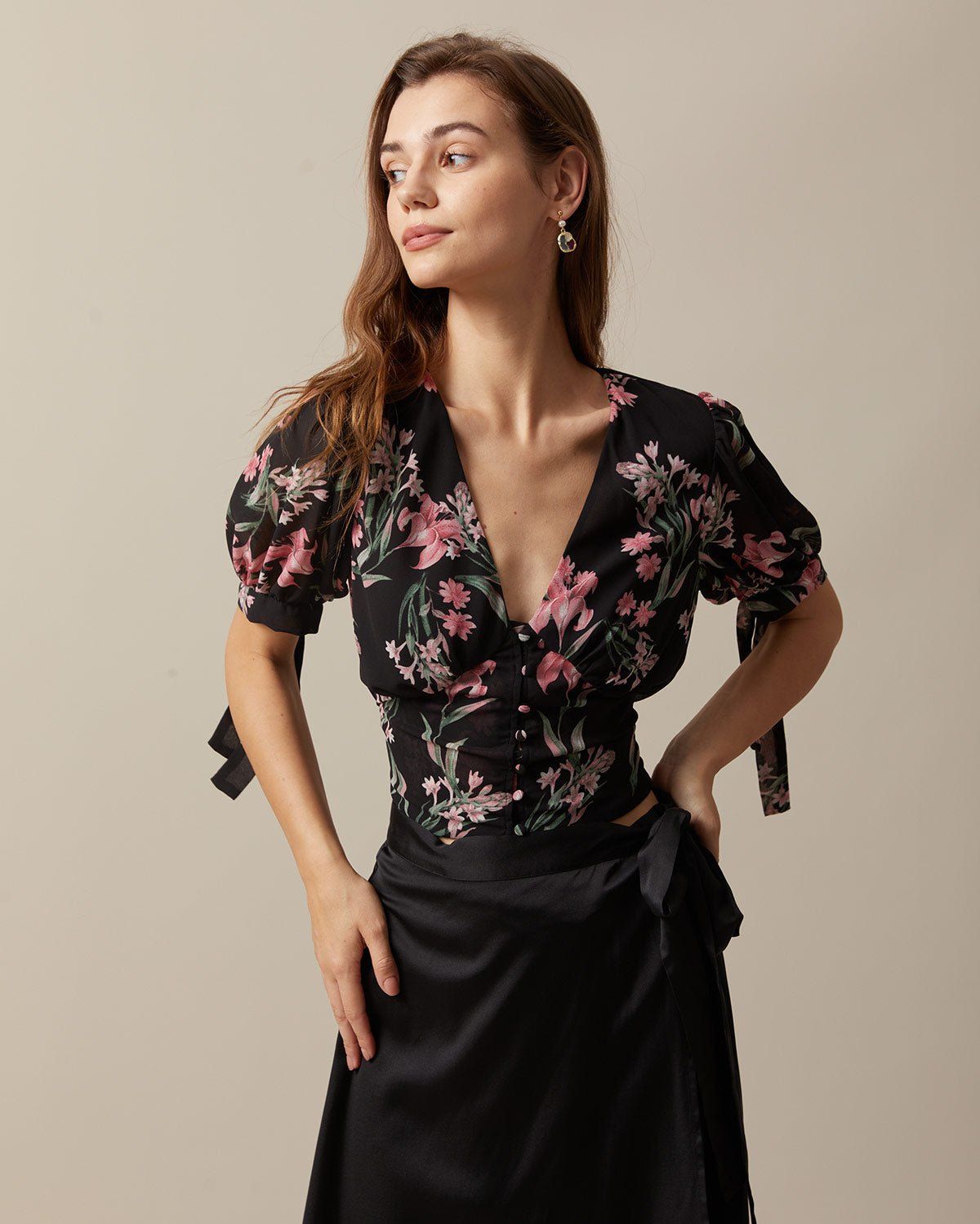 The Black V Neck Puff Sleeve Floral Ruched Blouse sold by rihoas