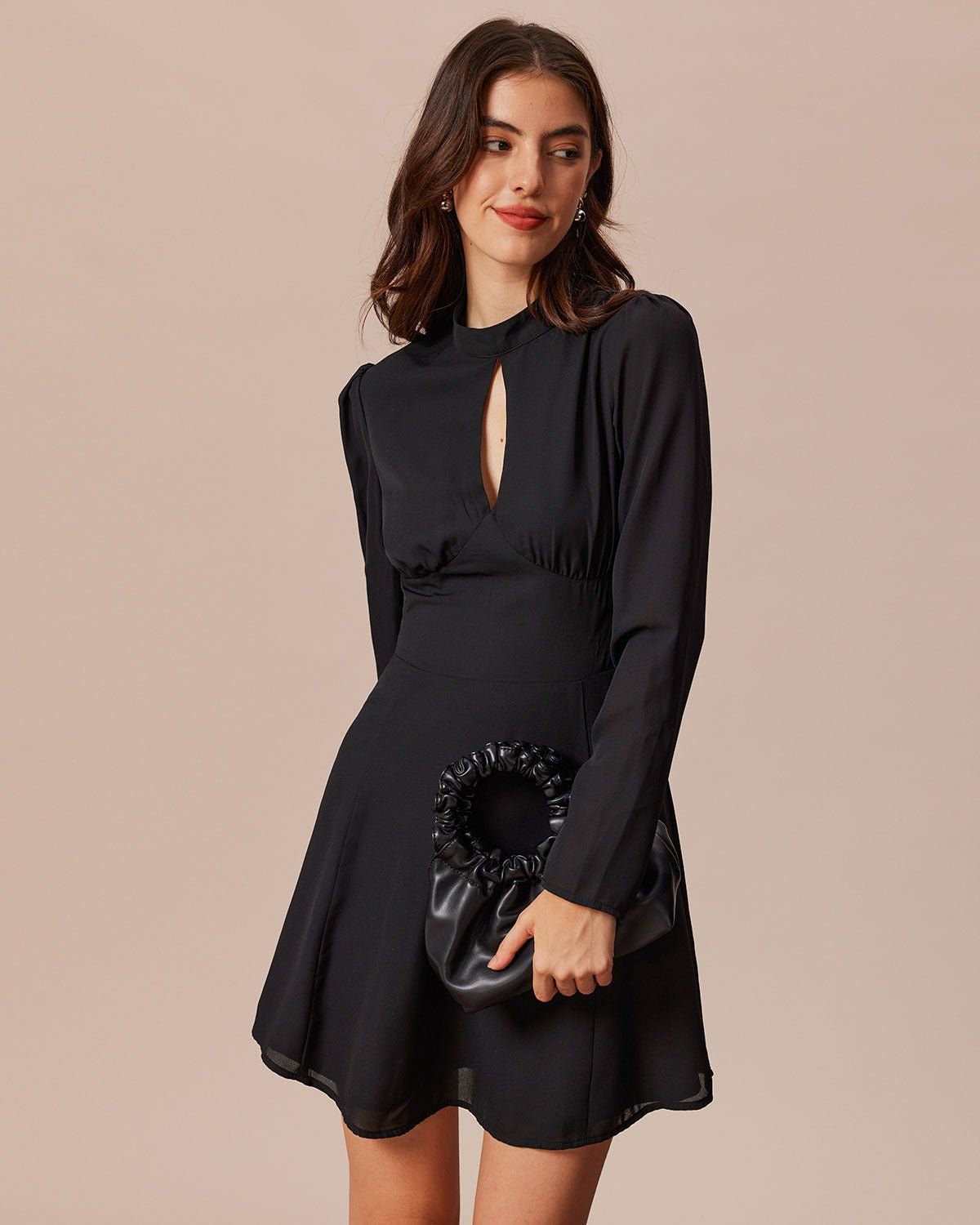 The Black Mock Neck Cutout Pleated Mini Dress sold by rihoas