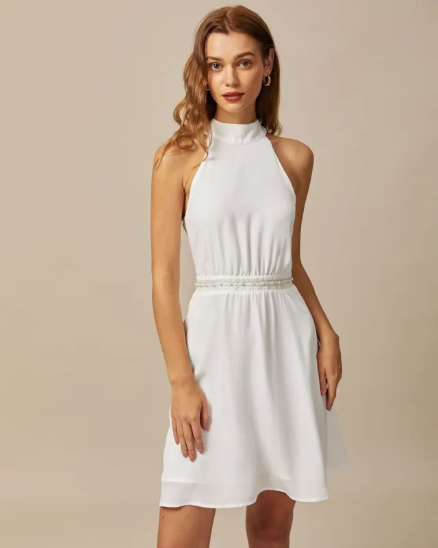 The White Mock Neck Pearls Backless Mini Dress sold by rihoas