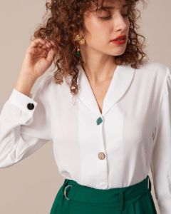 The White Lapel Button Long Sleeve Blouse sold by rihoas