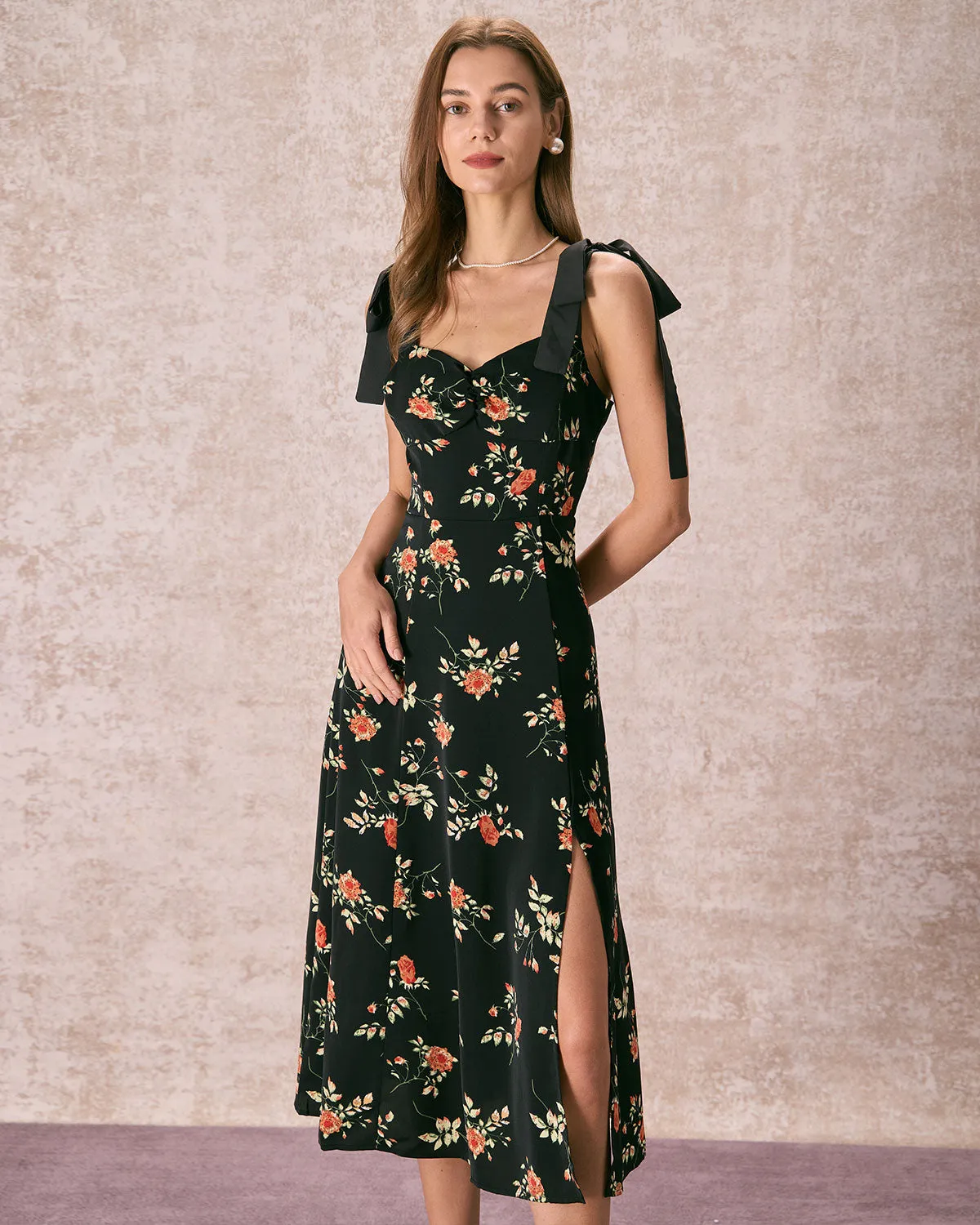 The Black Floral Ruched Tie Strap Slit Midi Dress sold by rihoas