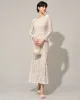 The White Lace Long Sleeve Backless Maxi Dress sold by rihoas