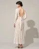 The White Lace Long Sleeve Backless Maxi Dress sold by rihoas