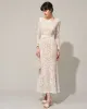 The White Lace Long Sleeve Backless Maxi Dress sold by rihoas
