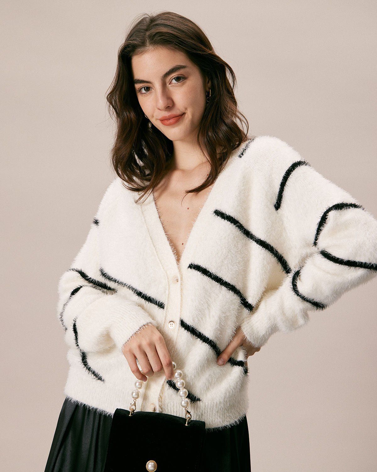 The White V Neck Fluffy Striped Cardigan sold by rihoas
