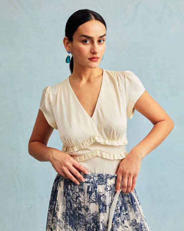 The Apricot V Neck Ruffle Cap Sleeve Satin Blouse sold by rihoas