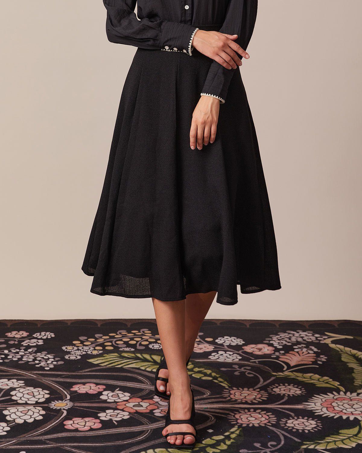 The Black Contrast Embroidery Midi Skirt sold by rihoas