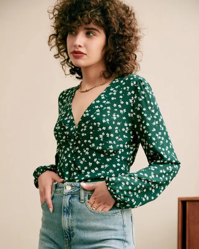 The V-Neck Floral Printed Blouse sold by rihoas