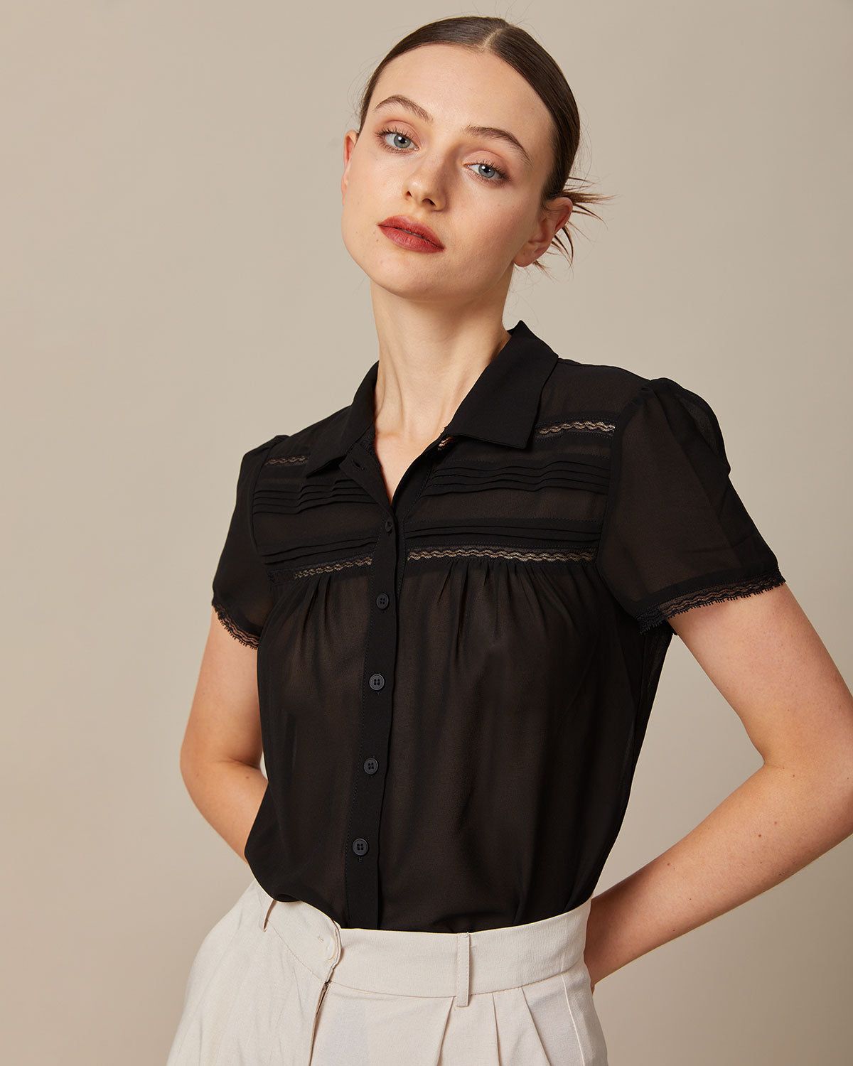The Black Lapel Lace Trim Pleated Blouse sold by rihoas